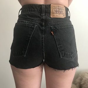 Vintage Levi high waisted black denim shorts.